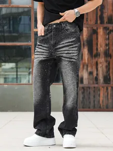 High-quality detail of men's black washed straight denim jeans with sparkling rhinestone decor