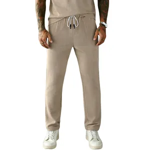 Men's casual corduroy drawstring trousers in khaki with straight-leg loose fit design