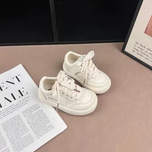 Stylish off-white children's sneakers with a star pattern and high-quality leather finish