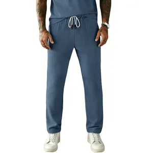 Detailed view of men's blue corduroy drawstring trousers showing fabric texture.