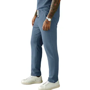 Side detail view of men's blue corduroy straight leg casual pants with white drawstring.