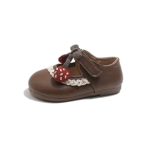 Elegant brown leather Mary Jane shoes for girls with lace trim and strawberry detail