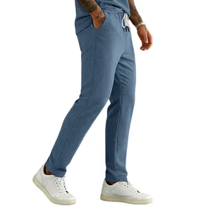 Close-up detail of men's blue corduroy drawstring pants with a comfortable straight-leg fit