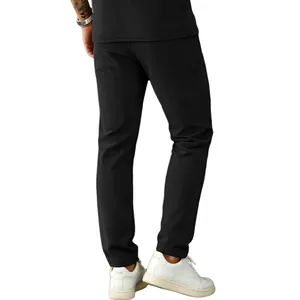 Detailed back view of men's minimalist black corduroy casual pants in a straight-leg fit