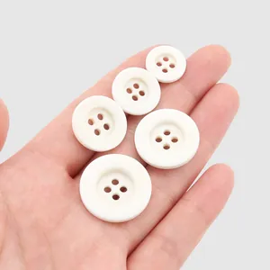 Set of high-quality white resin four-hole buttons in assorted sizes for elegant clothing