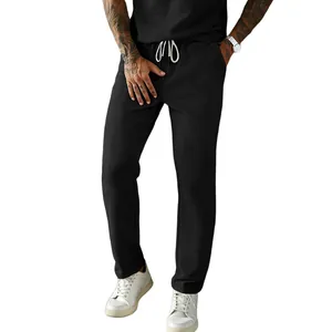 Detailed view of men's black corduroy casual pants featuring a white drawstring waist design