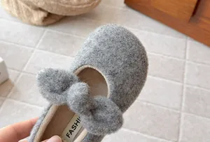 Detail view showing the soft grey fuzzy texture and plush lining of girls' winter shoes