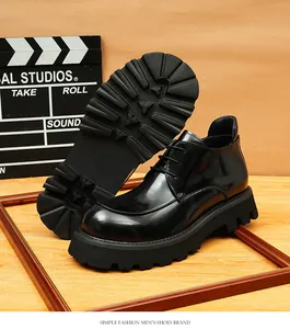 Detail view showing the high-gloss leather finish and thick lug sole of men's black boots