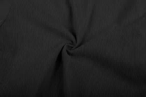 Close-up macro view of premium black corduroy fabric texture for men's casual pants