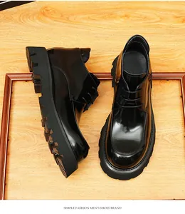 Detail of glossy black leather men's Martin boots with thick soles and British style design