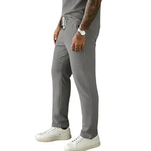 Detail view of grey thin corduroy men's pants with comfortable drawstring waist