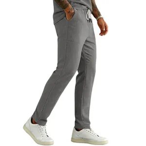 Detailed side view of grey corduroy casual pants with drawstring waist for men