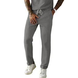 Detailed view of men's grey corduroy casual pants with adjustable drawstring waist