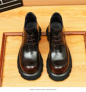 Top view of men's glossy brown leather platform boots with a British vintage style