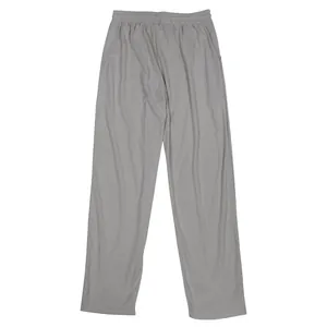 Close-up detail of grey corduroy sports trousers showing thin fabric and loose straight cut