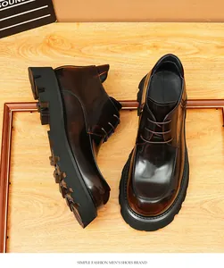 Detailed view of shiny dark brown men's leather boots with thick black lug soles