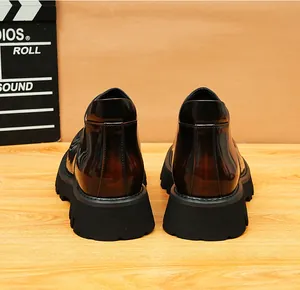 Detailed rear view of retro burnished leather boots with thick black platform soles