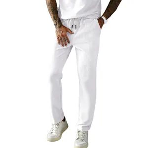 Men's white corduroy drawstring pants in a loose straight casual fit for summer wear