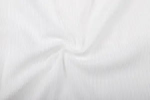 Macro shot of high-quality white corduroy fabric detail showing fine ribbed texture