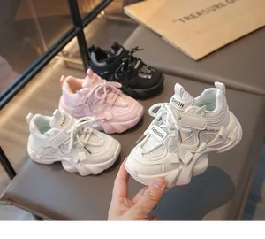 Detailed macro view of white girls' mesh fashion sneakers featuring FASHION lettering detail