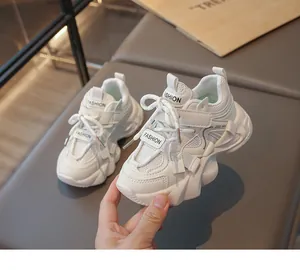 Detailed view of white chunky mesh sports sneakers for girls featuring a stylish dad shoe design.