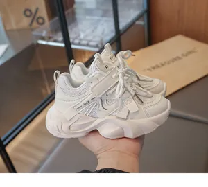 Macro view of white breathable mesh and thick sole of girls' fashion chunky sneakers