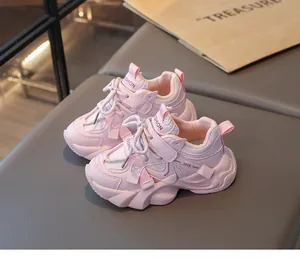 Detailed view of pink breathable mesh sports sneakers for girls featuring chunky soles.