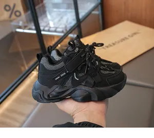 Detailed close-up of girls' black breathable mesh sneakers for sports