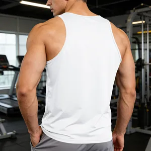 Back view of a white quick-dry men's athletic tank top in a gym setting