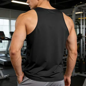 Back view of a black quick-dry men's gym racerback tank top in a professional fitness center