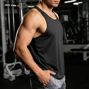 Close-up of men's quick-dry black racerback tank top in professional gym setting