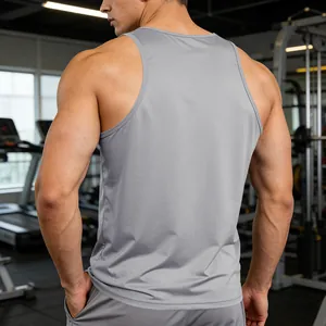Detailed back view of a gray quick-dry men's athletic gym tank top in a professional fitness center