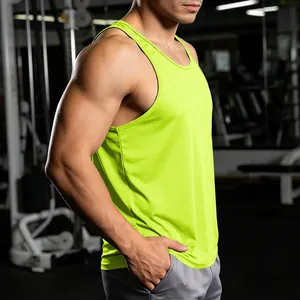 Side view of a neon green racerback gym tank top for men in a fitness setting