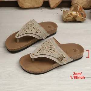 Detail view showing the 3cm wedge heel height of the ethnic hollow slippers
