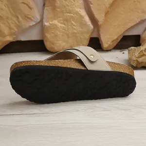 Detailed view of non-slip rubber sole and cork midsole on women's summer slide sandals