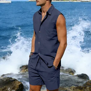Men's navy blue linen sleeveless shirt and shorts beach set worn by model at seaside