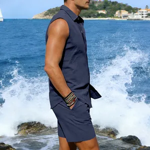 Detail of man wearing dark blue linen sleeveless shirt and shorts set on a beach background