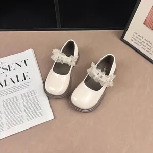 Cream Mary Jane shoes for girls with lace and pearl details in British style