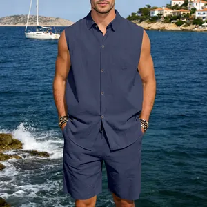 Close-up of men's navy blue linen sleeveless shirt and shorts set in coastal resort setting