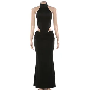 Elegant black halter neck bodysuit paired with a long matching skirt on a mannequin.