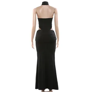 Rear view of a sexy black halter neck bodysuit and maxi skirt two-piece set.