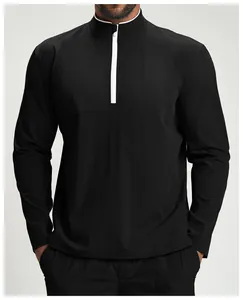 Detail of men's black half-zip sports jacket with contrasting white collar trim.