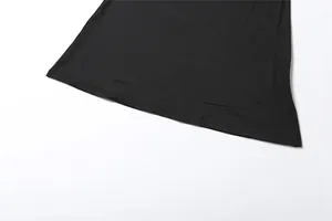 Detailed close-up view showing the hemline of a solid black high-stretch fabric dress