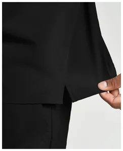 Detailed view showing the side slit and high-quality stitching on black sport jacket hem