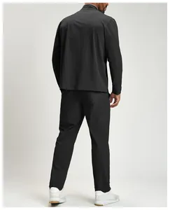 Full back view of a man wearing a black quick-dry recycled sports tracksuit set
