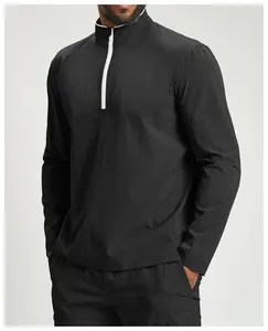 Close-up of men's quick-dry sports jacket featuring a white half-zip and mock neck design.
