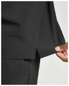 Detail view of the hem slit on a men's recycled quick-dry outdoor sports jacket