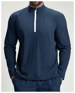 Close-up of navy blue quick-dry quarter-zip sports jacket with white contrast zipper detail