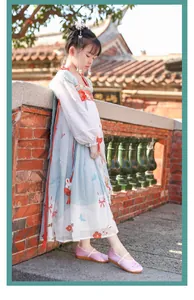 Girl wearing purple embroidered Hanfu shoes in a traditional garden