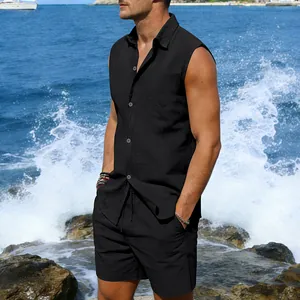 Close-up of a men's black sleeveless linen shirt and matching shorts on a beach model
